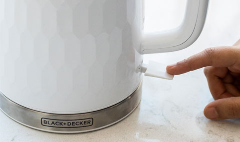 On/off switch is located beneath the handle.